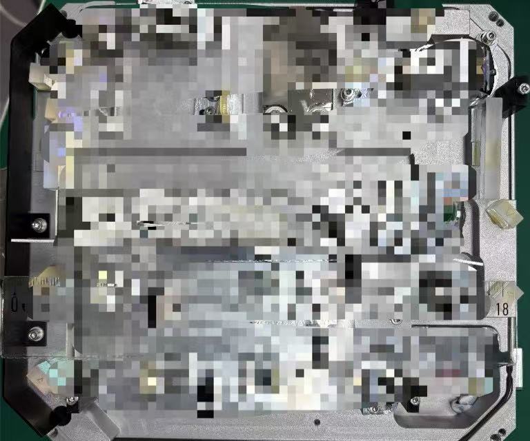 Open semiconductor laser unit showing internal assemblies